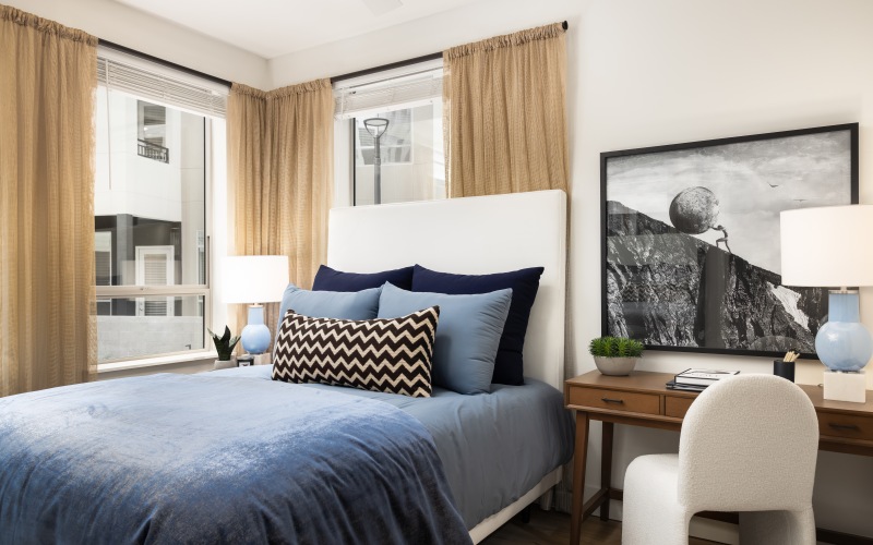 a bedroom with a large window